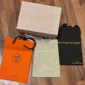 Van Cleef & Arpels Black and Sage Bag, Jimmy Choo box and Hermes orange bag